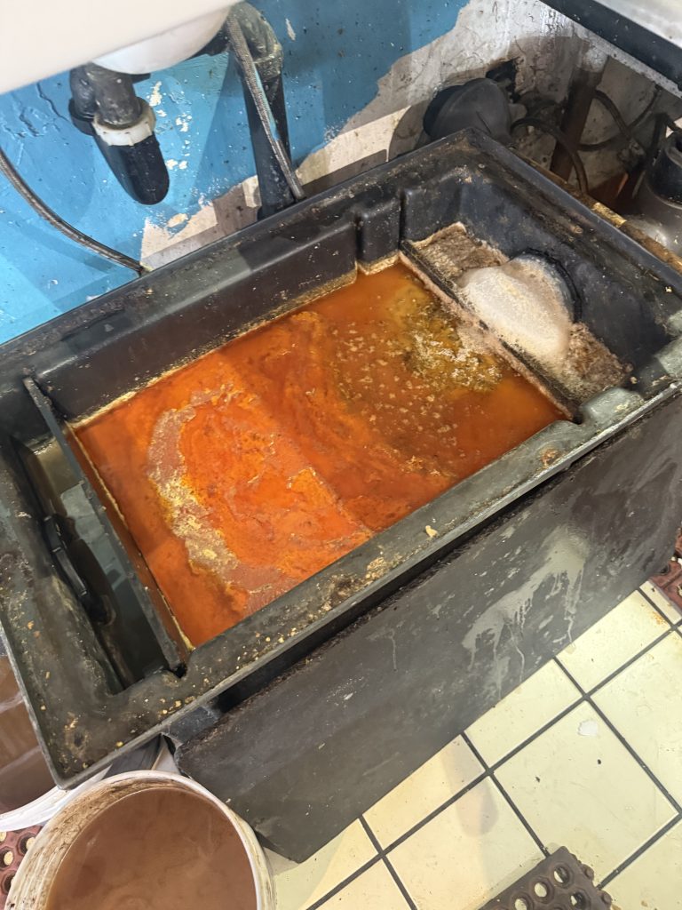 Full Grease Trap Before grease trap Cleaning