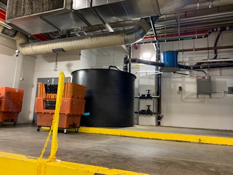 Used cooking oil stored in a commercial oil collection container
